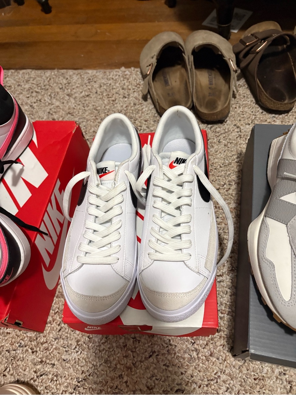 Nike White Sneakers with Black Swoosh and Cream Accents